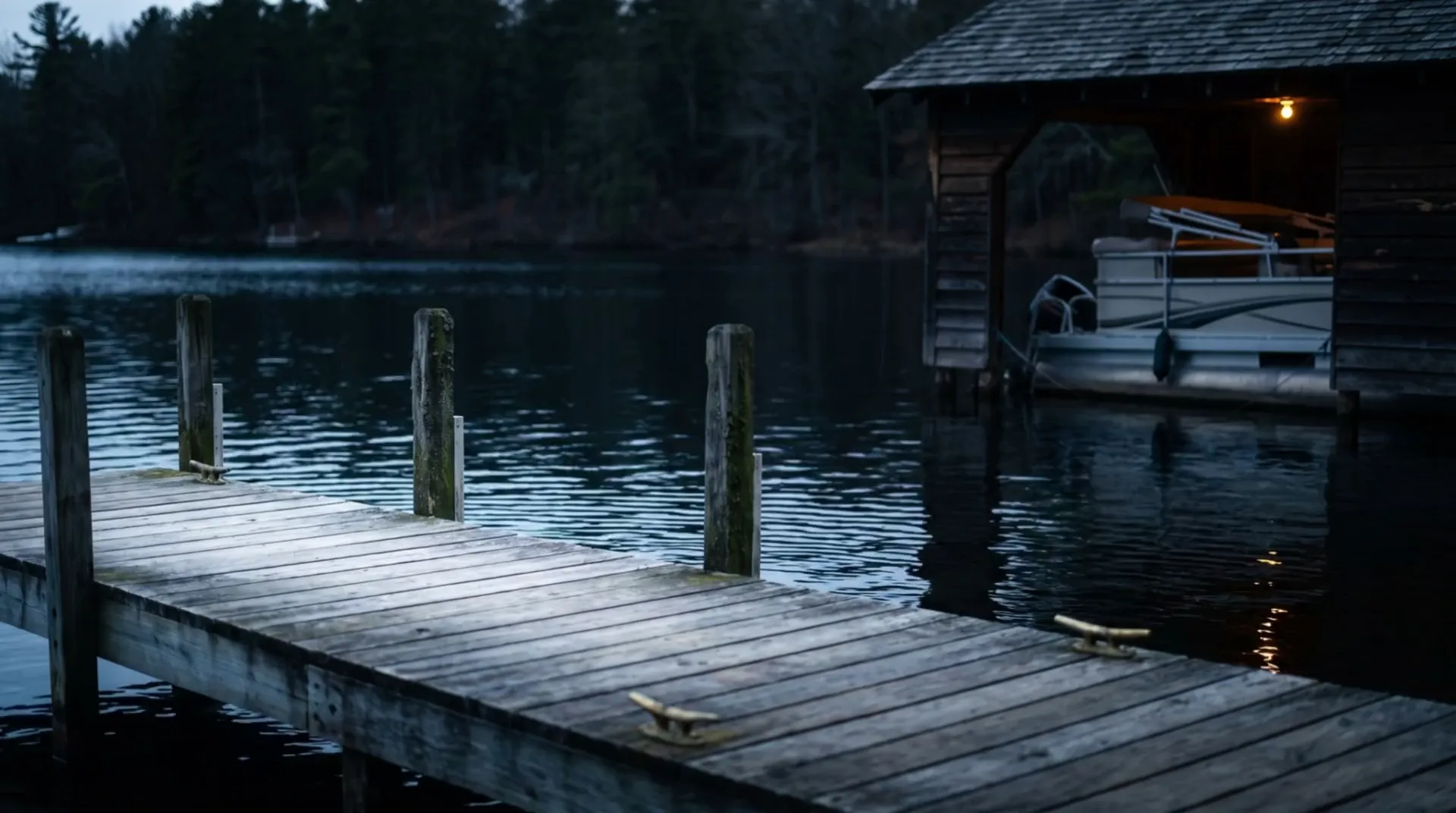 Illustrative dusk view from a wooden dock across a quiet lake bay