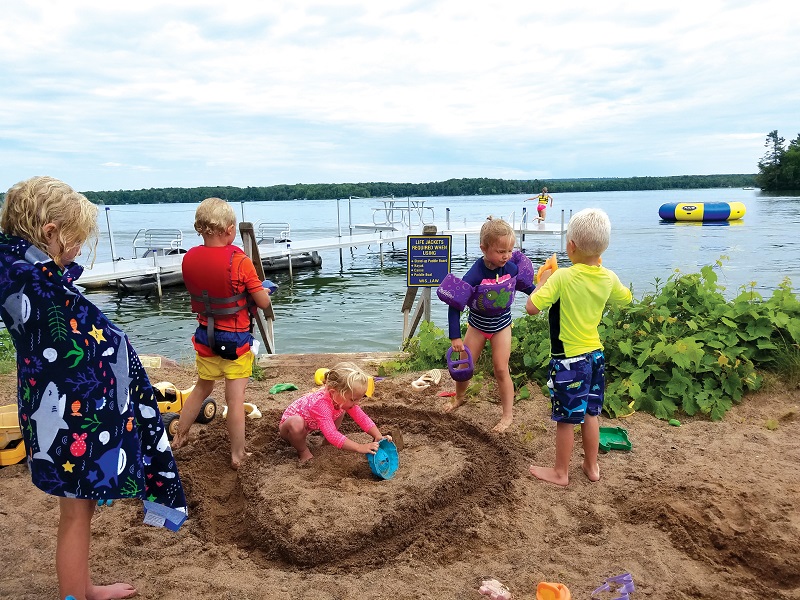 The sandy swim area at Fred Thomas Resort beside Lake Chetac